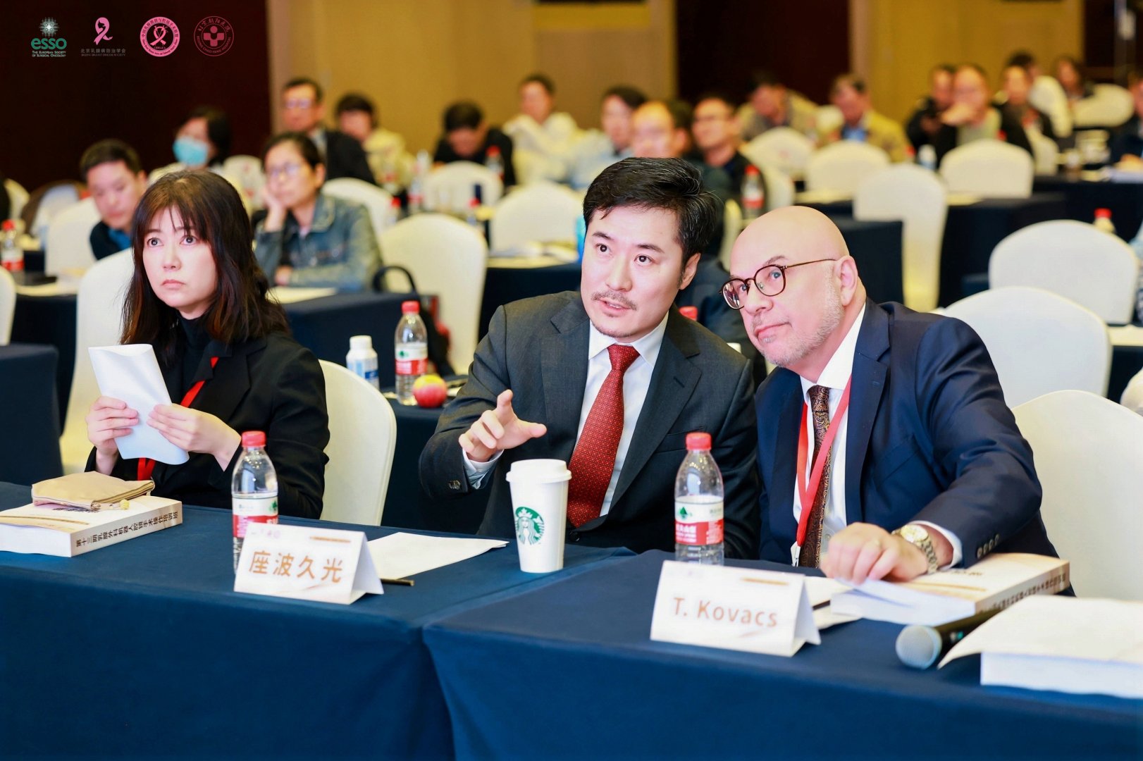 Faculty members in discussion during the course