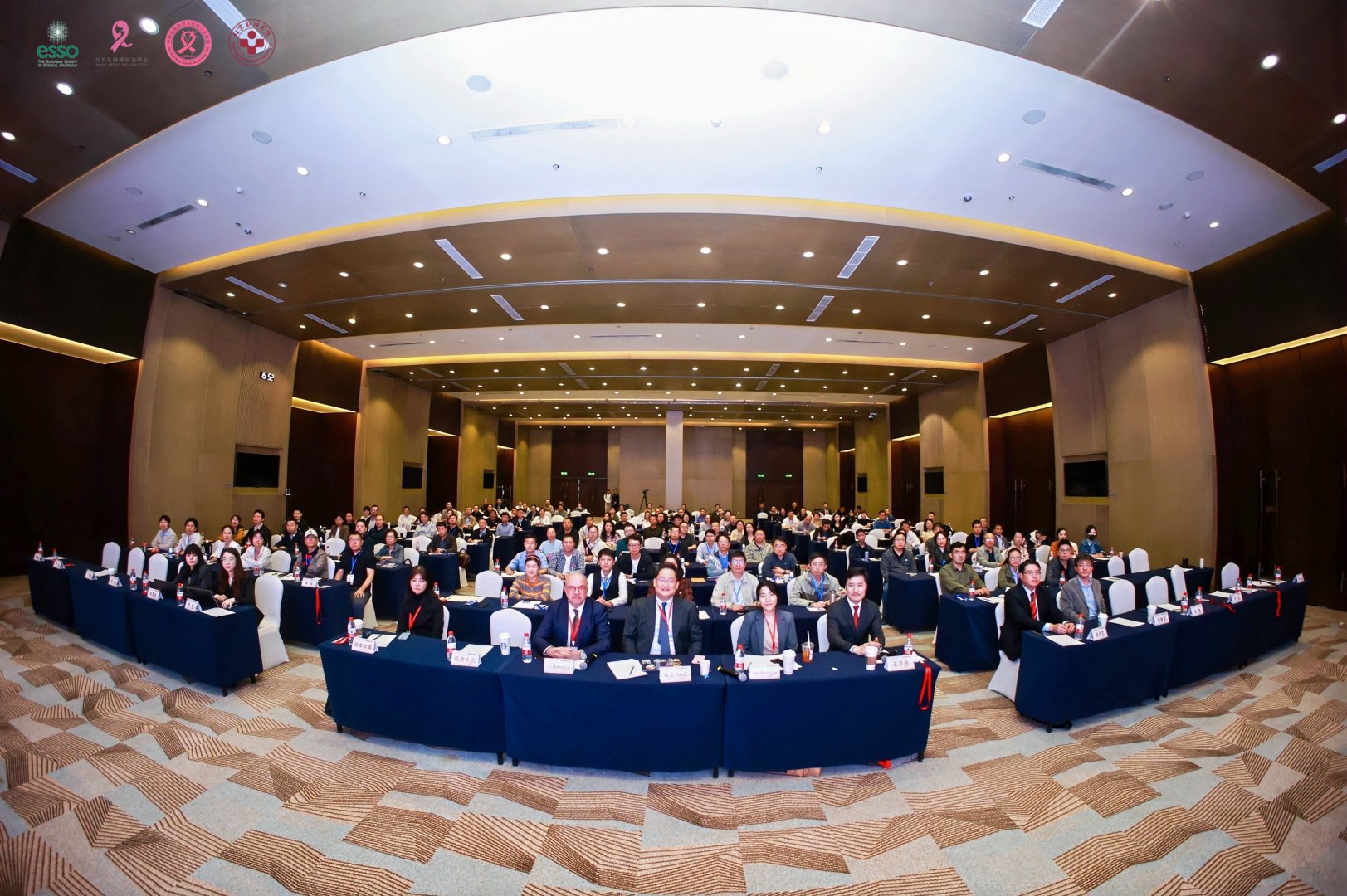 Panoramic view of a full auditorium during the course