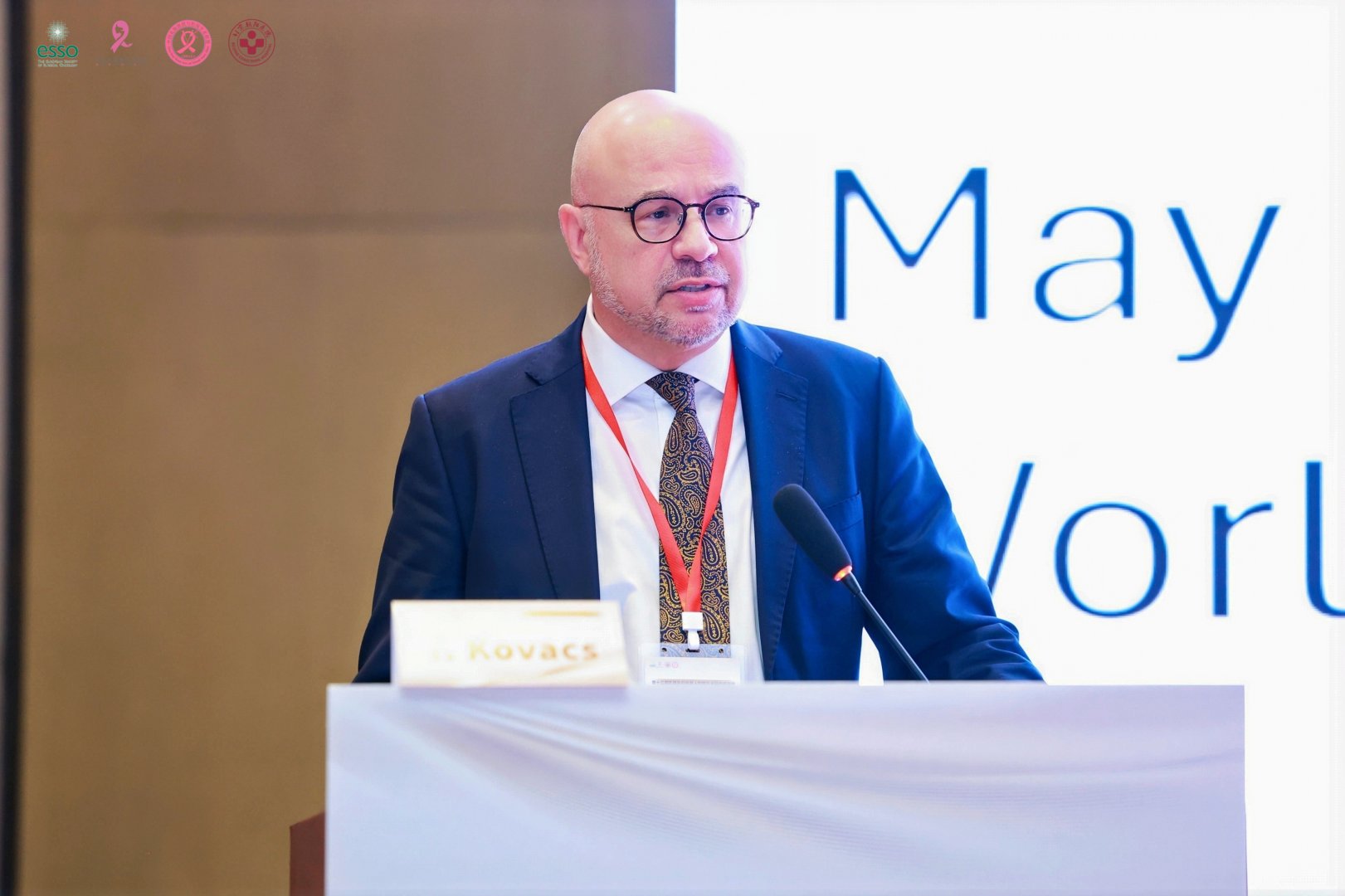 Professor Tibor Kovacs delivering a lecture at the podium
